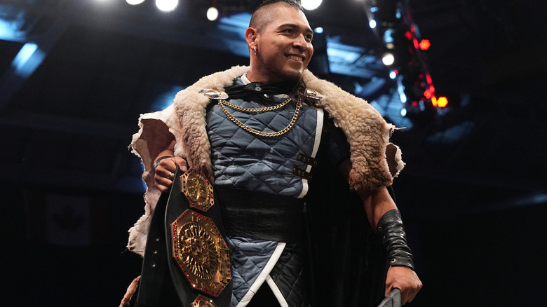 El Hijo Del Vikingo smiles with his title belt