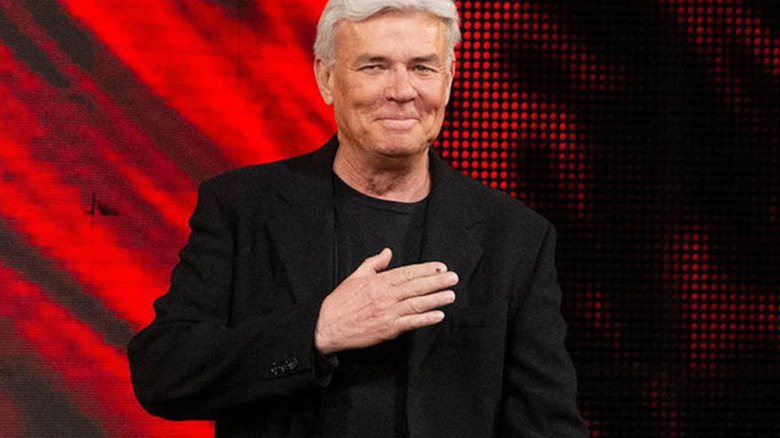 Eric Bischoff smiling hand on chest