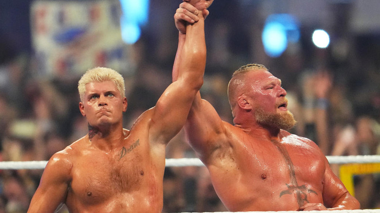 Cody Rhodes & Brock Lesnar raising each other hands