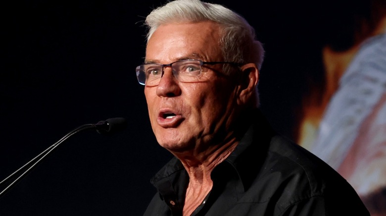 Eric Bischoff speaks into mic