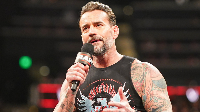 Cm punk holding a microphone