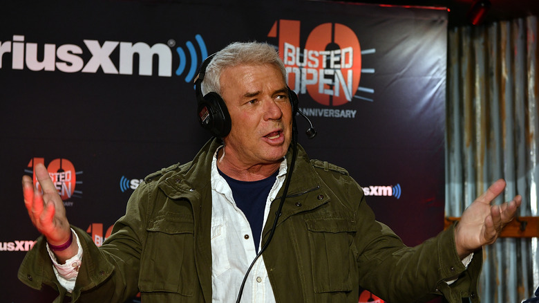 Eric Bischoff talking while wearing a headset