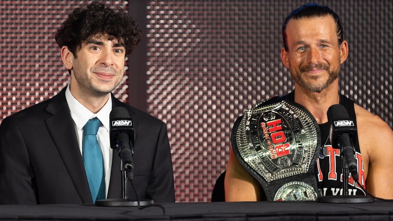 Tony Khan And Adam Cole Smile At An AEW Presser