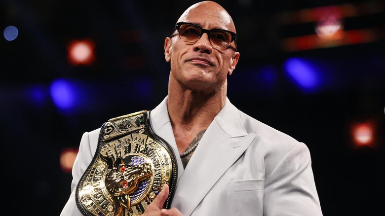 The Rock during the 2024 Hall of Fame ceremony, accepting the People's Championship.