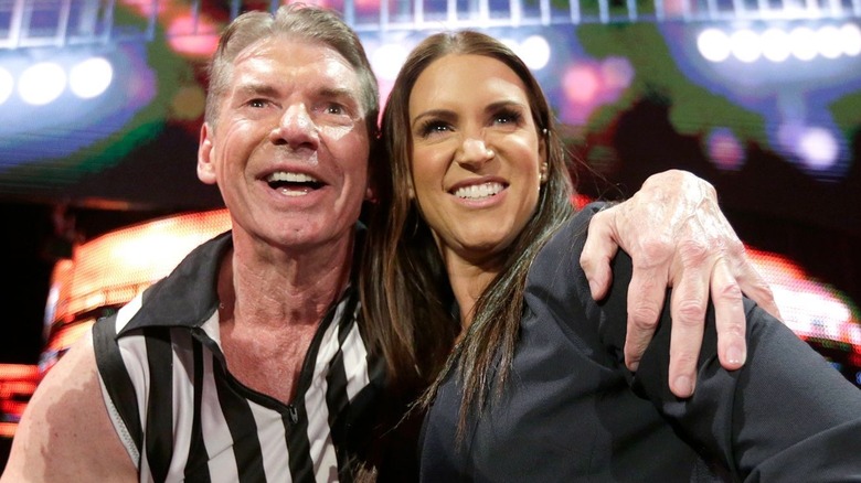 Stephanie and Vince embrace each other after Vince referees for a match