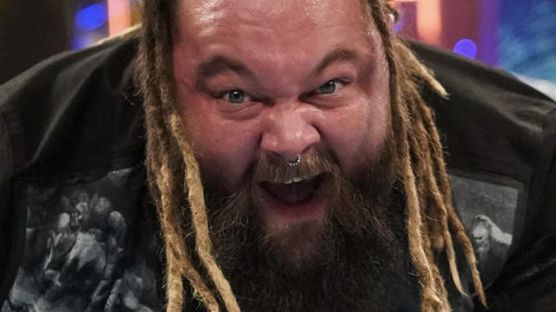 Bray Wyatt attacking a man