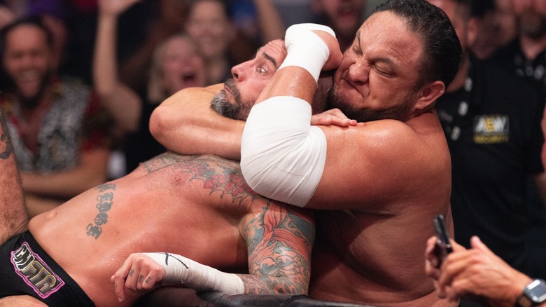 Samoa Joe chokes out CM Punk on AEW TV