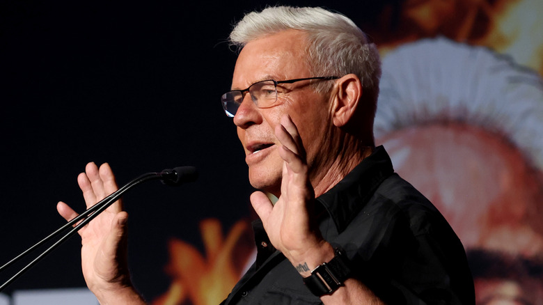 Eric Bischoff holds up his hands