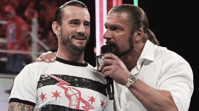 Triple H talking to CM Punk