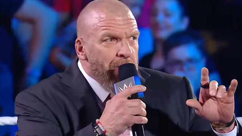 Triple H with a microphone