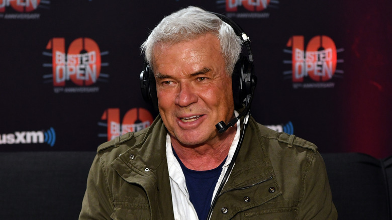 Eric Bischoff wearing headphones on the set of Busted Open