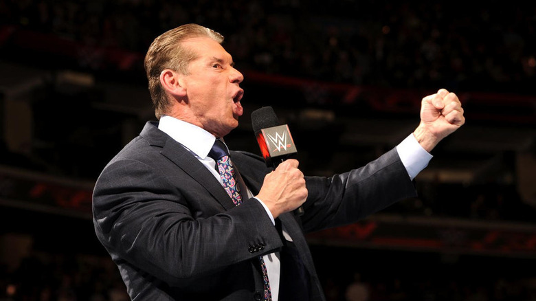 Vince McMahon raising his left fist