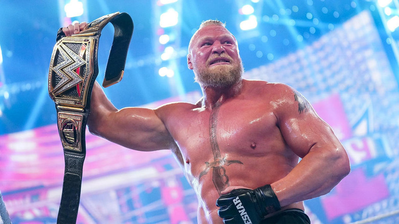 Brock Lesnar raises WWE Championship