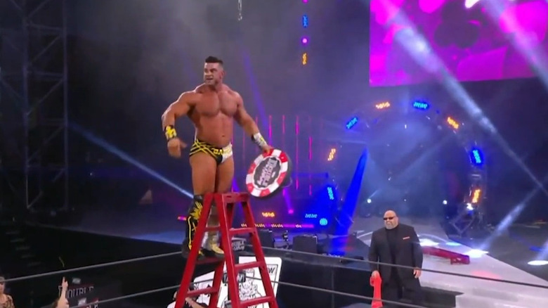 Brian cage holds poker chip