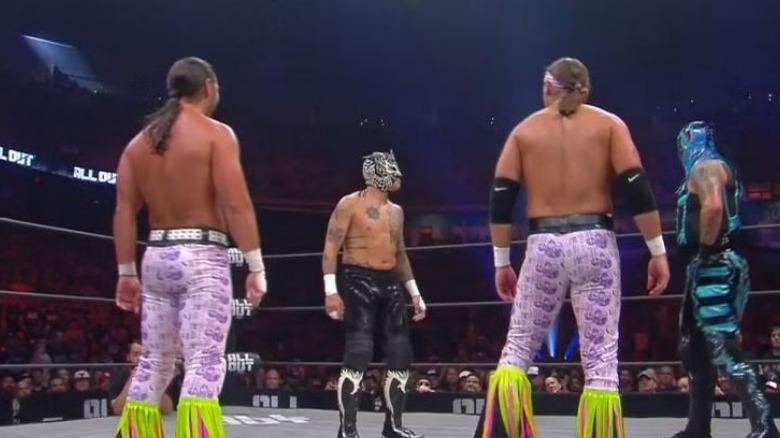 The Young Bucks in the ring with the Lucha Brothers