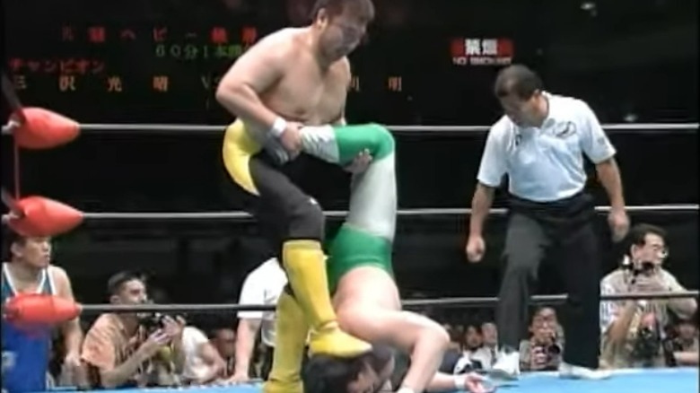 Toshiaki Kawada puts Mitsuahru Misawa in a submission hold