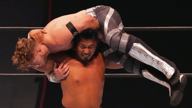 Shingo Takagi with Will Ospreay on his shoulders