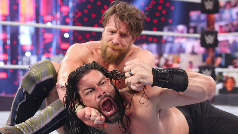 Daniel Bryan grapples Roman Reigns