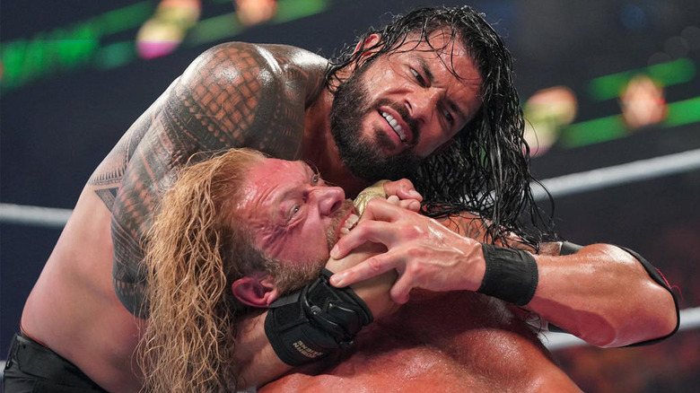 Roman Reigns chokes Edge