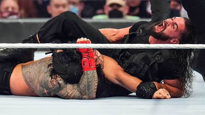 Seth Rollins attacks Roman Reigns