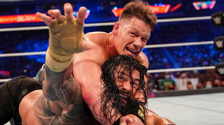 John Cena chokes Roman Reigns