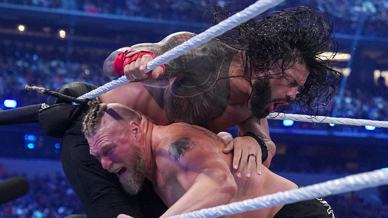 Brock Lesnar attacks Roman Reigns