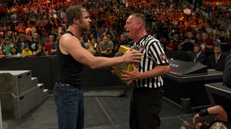 Dean Ambrose cashing in money in the bank
