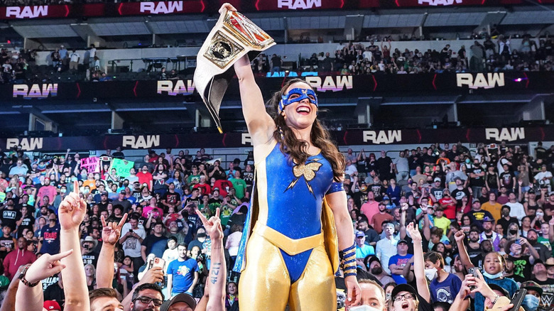 Nikki A.S.H. holding Raw Women's Championship