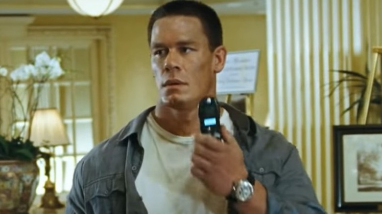 John Cena holds cell phone