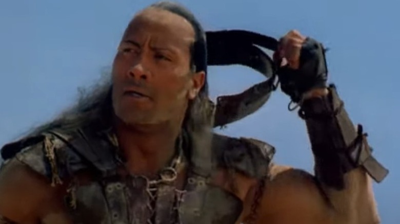 Dwayne "The Rock" Johnson removes headgear