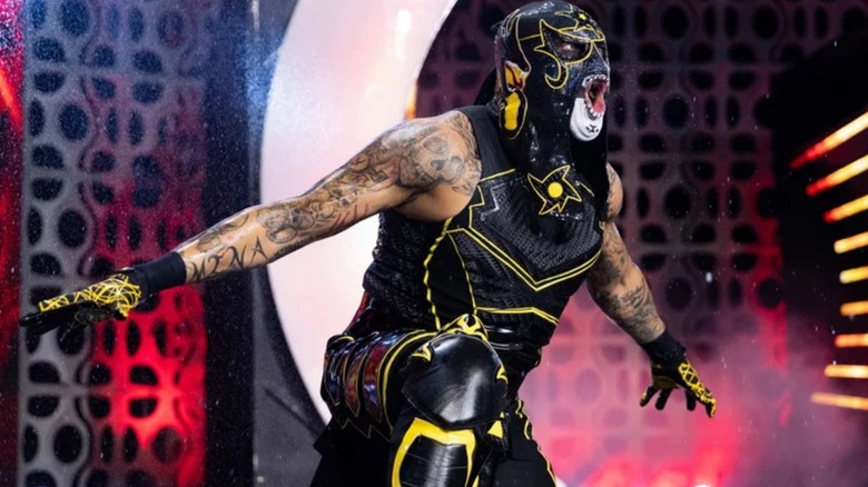 Penta poses on the stage before heading down the ramp for a match on AEW programming.