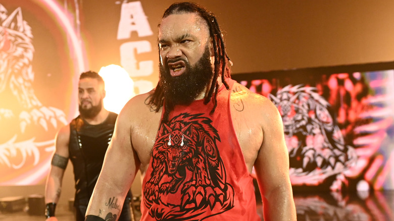 Jacob Fatu wearing a red tank top