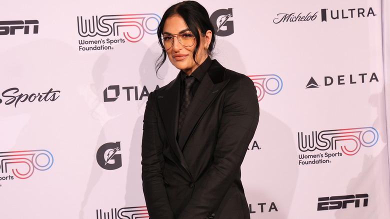 Sonya Deville posing on red carpet