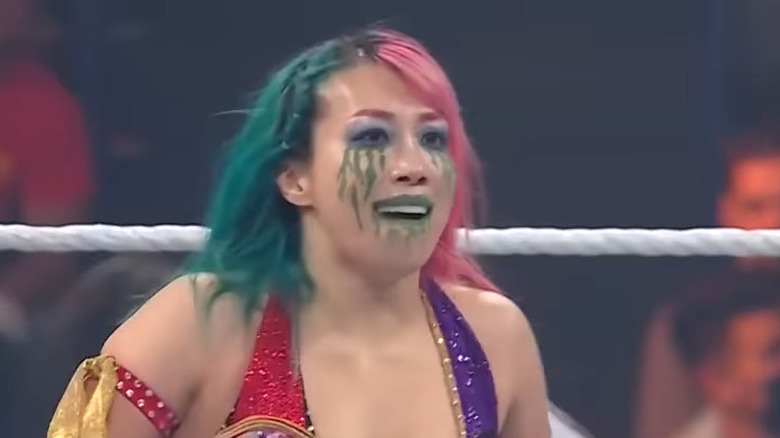 Asuka standing in the ring