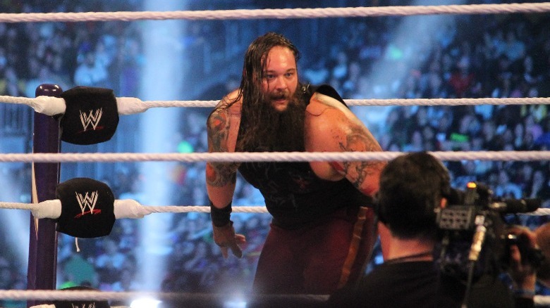 Bray Wyatt leans in ring