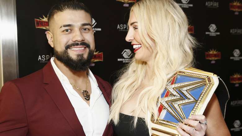 Andrade And Charlotte Flair Smiling Together