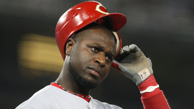 Brandon Phillips adjusts helmet