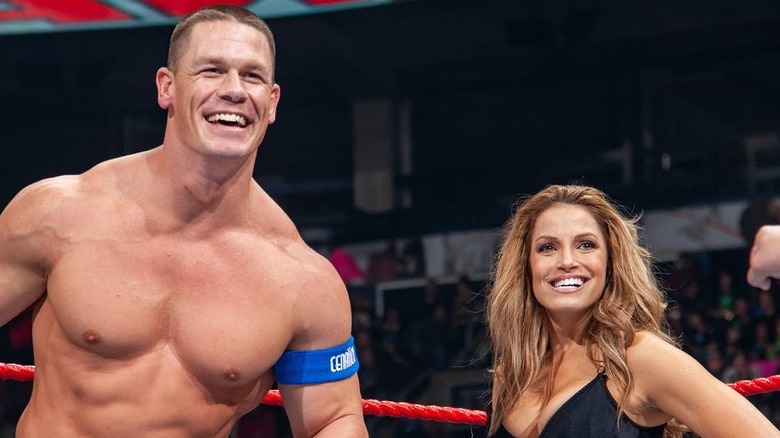 Trish Stratus and John Cena smiling