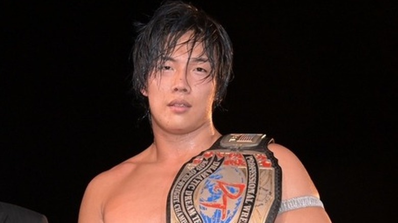 Konosuke Takeshita with a championship