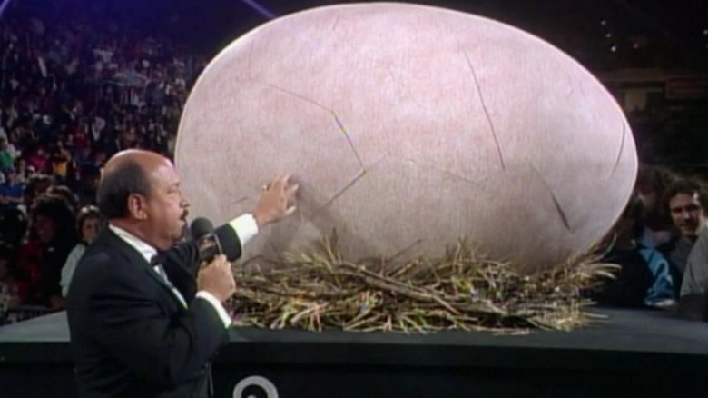 Gene Okerlund touching a giant egg