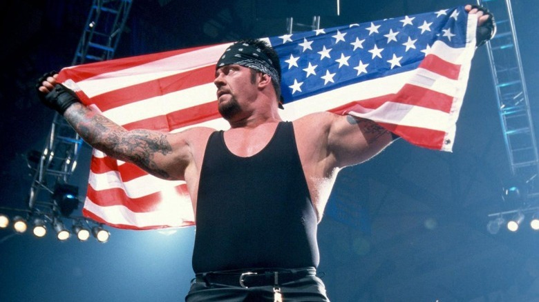 Undertaker holding an American flag