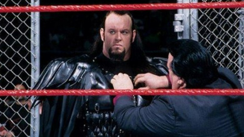 Paul Bearer removing Undertaker's entrance gear