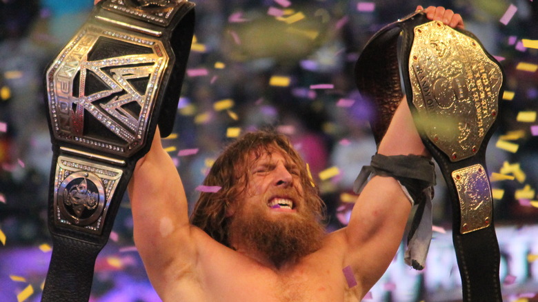 Daniel Bryan raises the belts