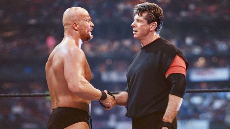 Stone Cold shakes Vince McMahon's hand