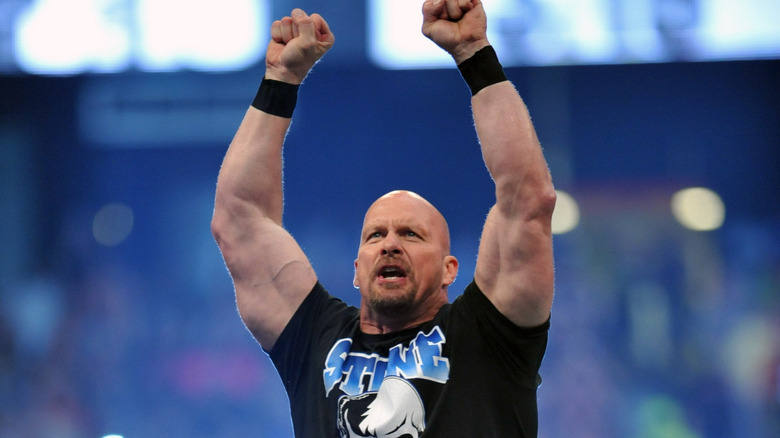 Stone Cold Steve Austin with his fists up in the air