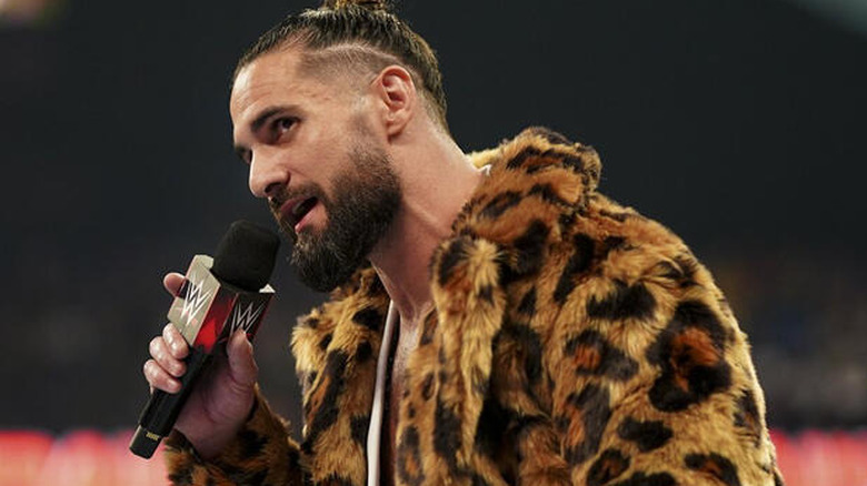 Seth Rollins holding microphone