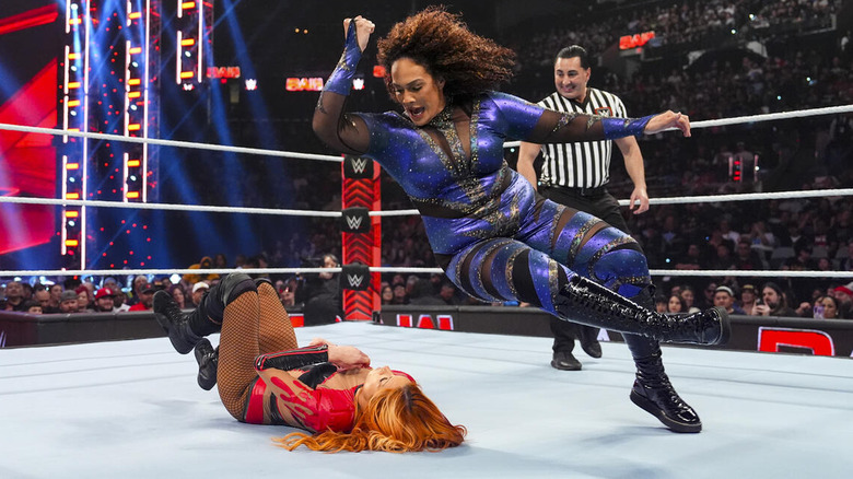 Nia Jax delivers an elbow drop to Becky Lynch