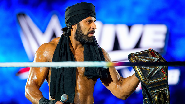 Jinder Mahal holds up WWE title