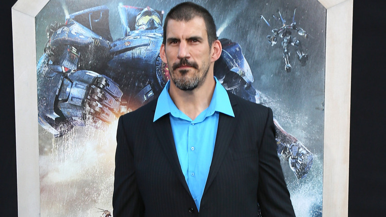 Robert Maillet in front of a Pacific Rim background