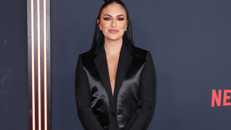 Sonya Deville posing on red carpet